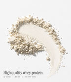 A styled product shot of a light beige powder protein smear on a clean white background, with text below reading 'High quality whey protein.' and smaller claims 'EU SOURCED | NON-GMO | 3RD PARTY TESTED'.